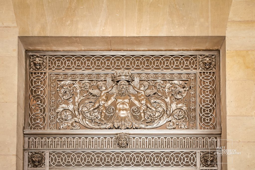 The thresholds at the Louvre are dressed to impress—elegant metalwork marks the entrance to artistry.