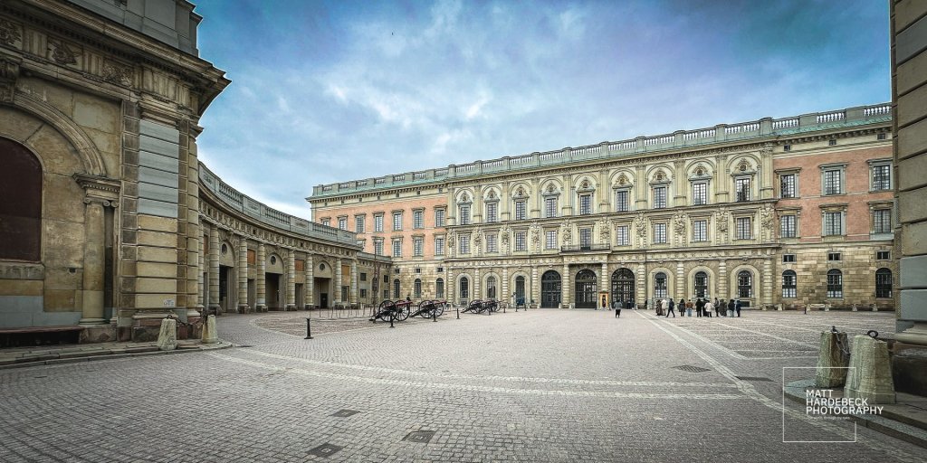 Stockholm Royal Palace courtyard with arched wings and visitors