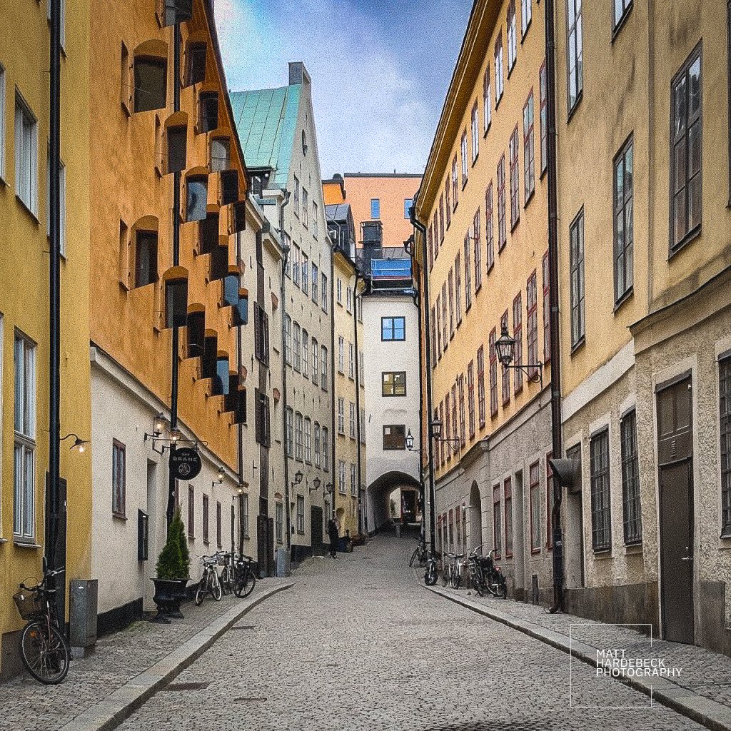 Quiet cobbled alley with bicycles