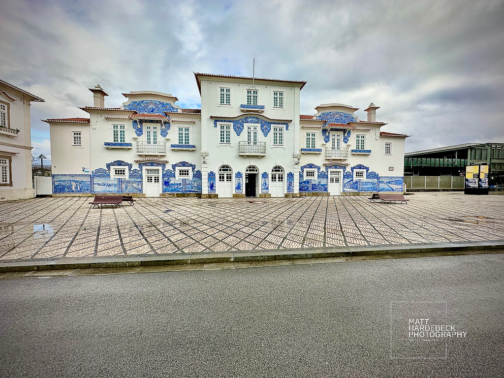 Historic railway station decorated with blue-and-white azulejo tiles in Aveiro, Portugal.