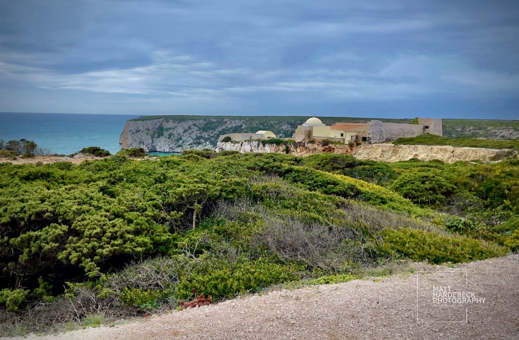 Coastal fort and white-domed buildings on the cliffs at Cabo de São Vicente, Portugal.