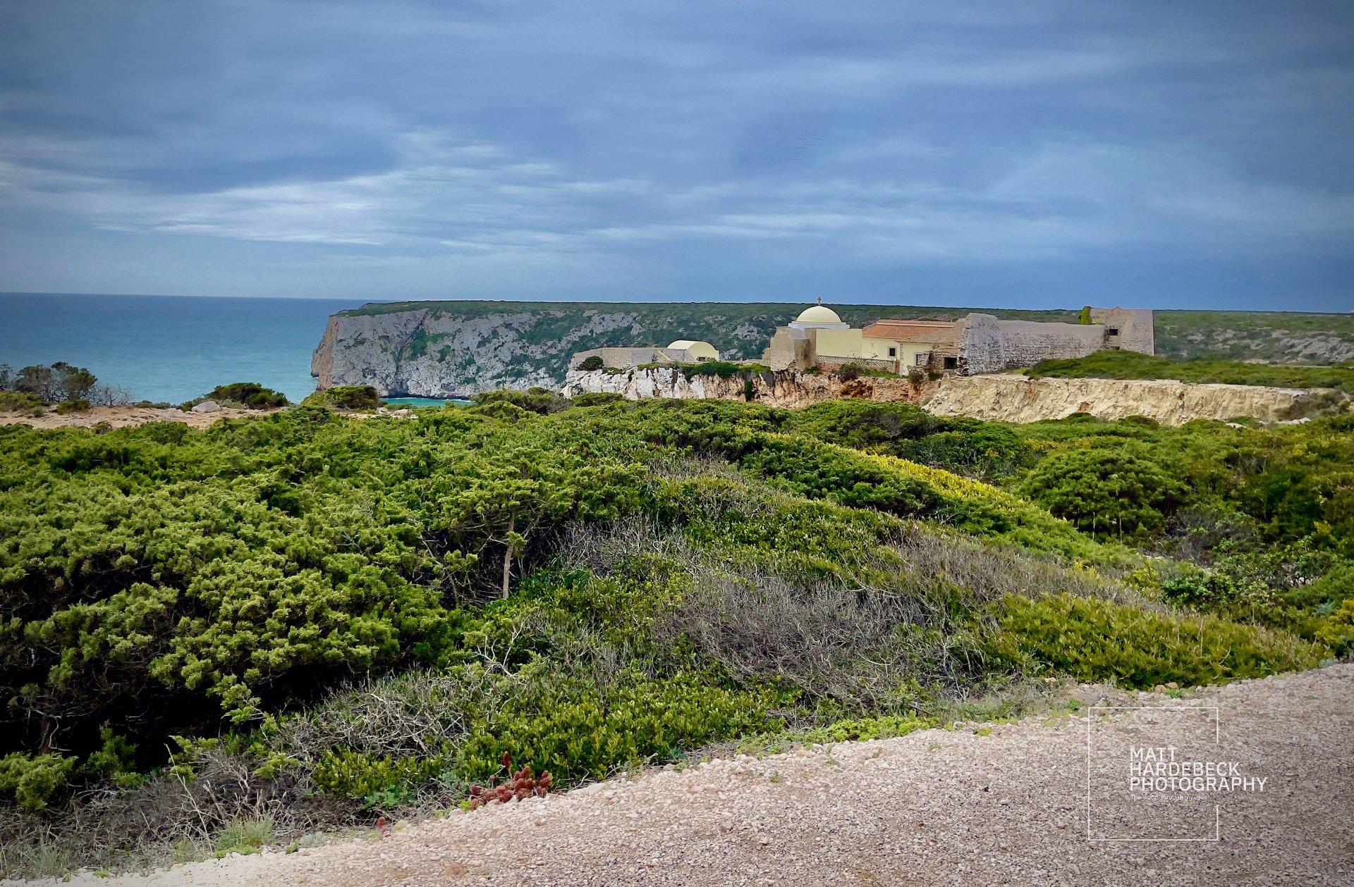 Coastal fort and white-domed buildings on the cliffs at Cabo de São Vicente, Portugal.