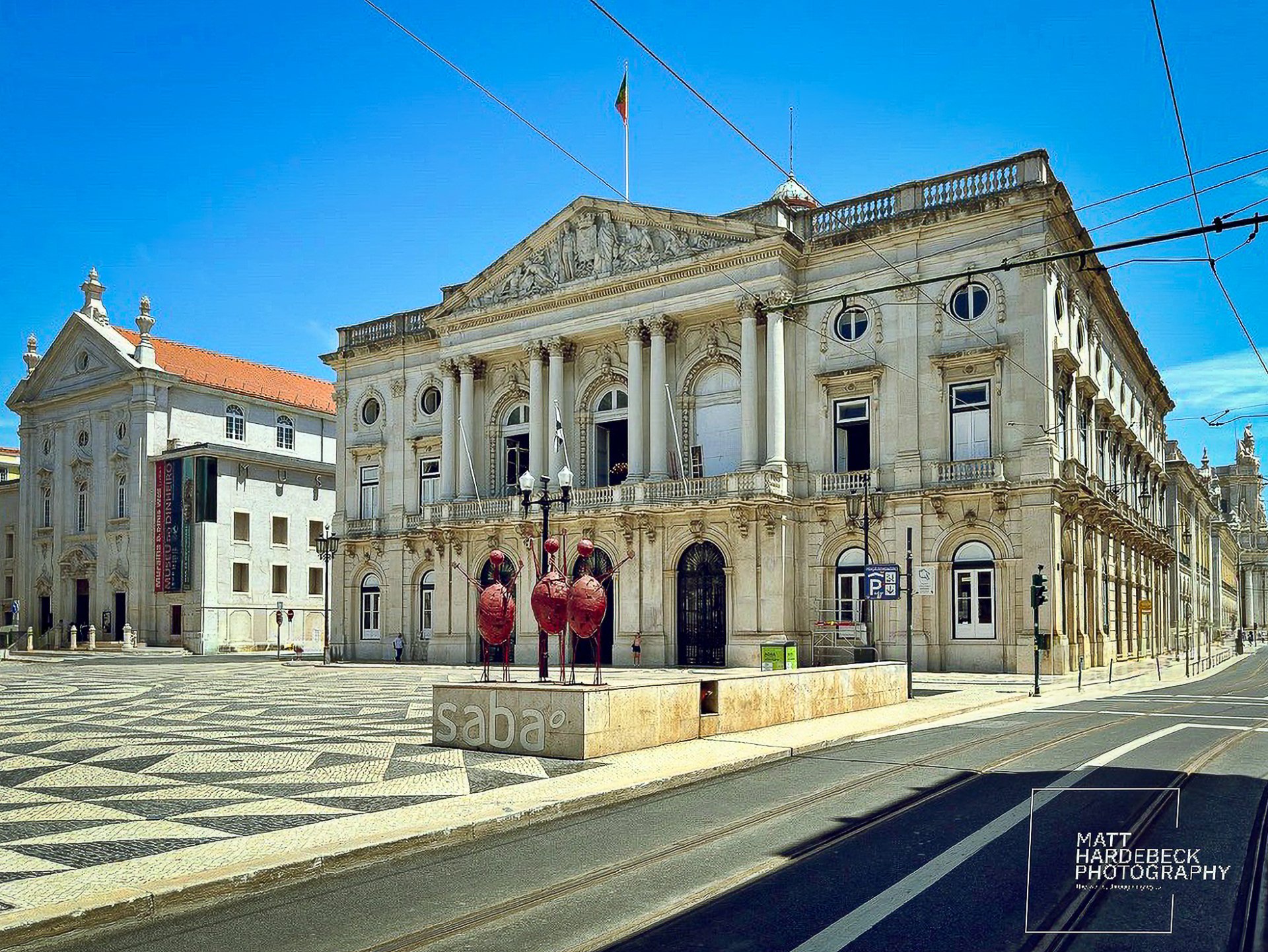 The ornate façade of Lisbon City Hall under a bright blue sky.