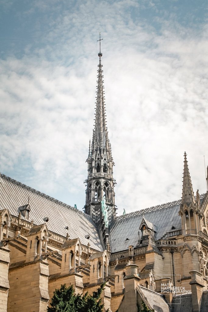 Close-up of the Notre-Dame Cathedral’s spire and roofline before the 2019 fire.