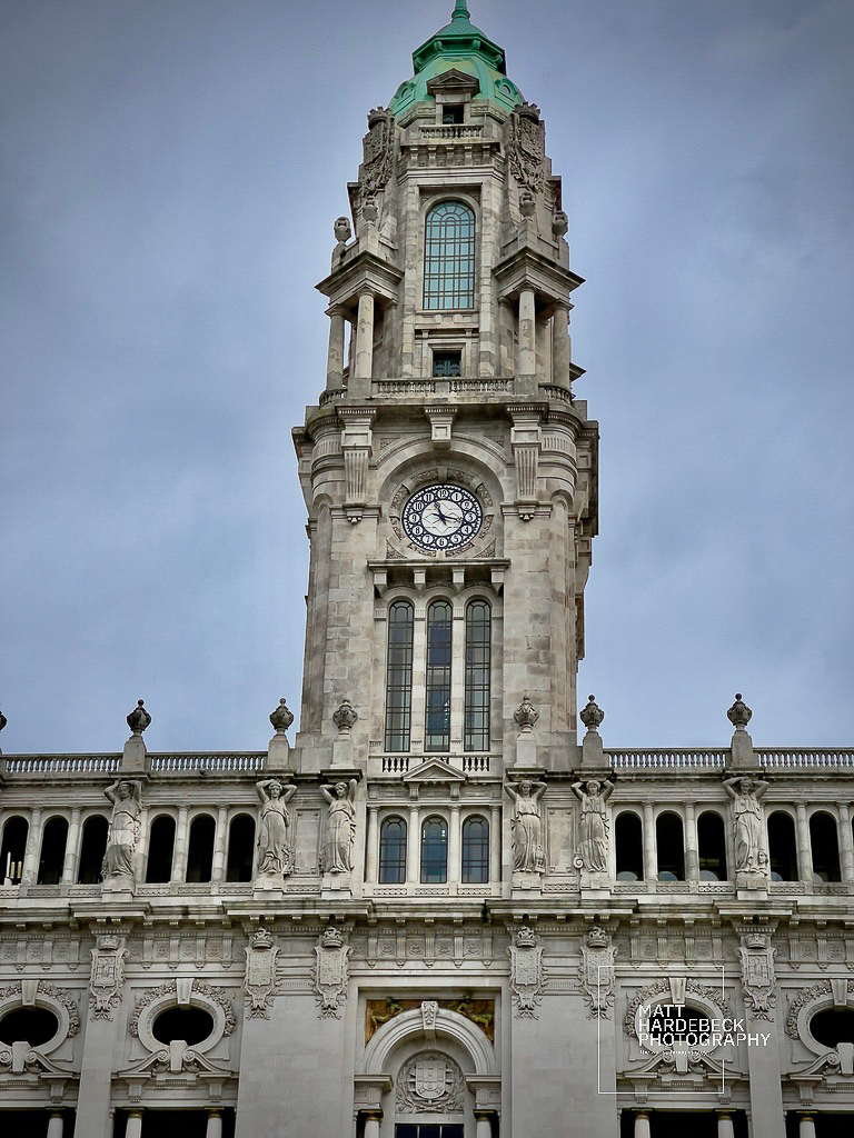 The clock tower of Porto’s City Hall rising above an ornate stone facade.