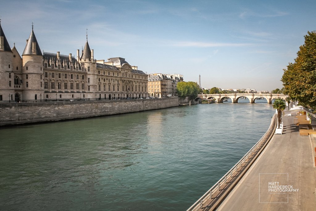 View of the Conciergerie and Seine River with Eiffel Tower in the distance
