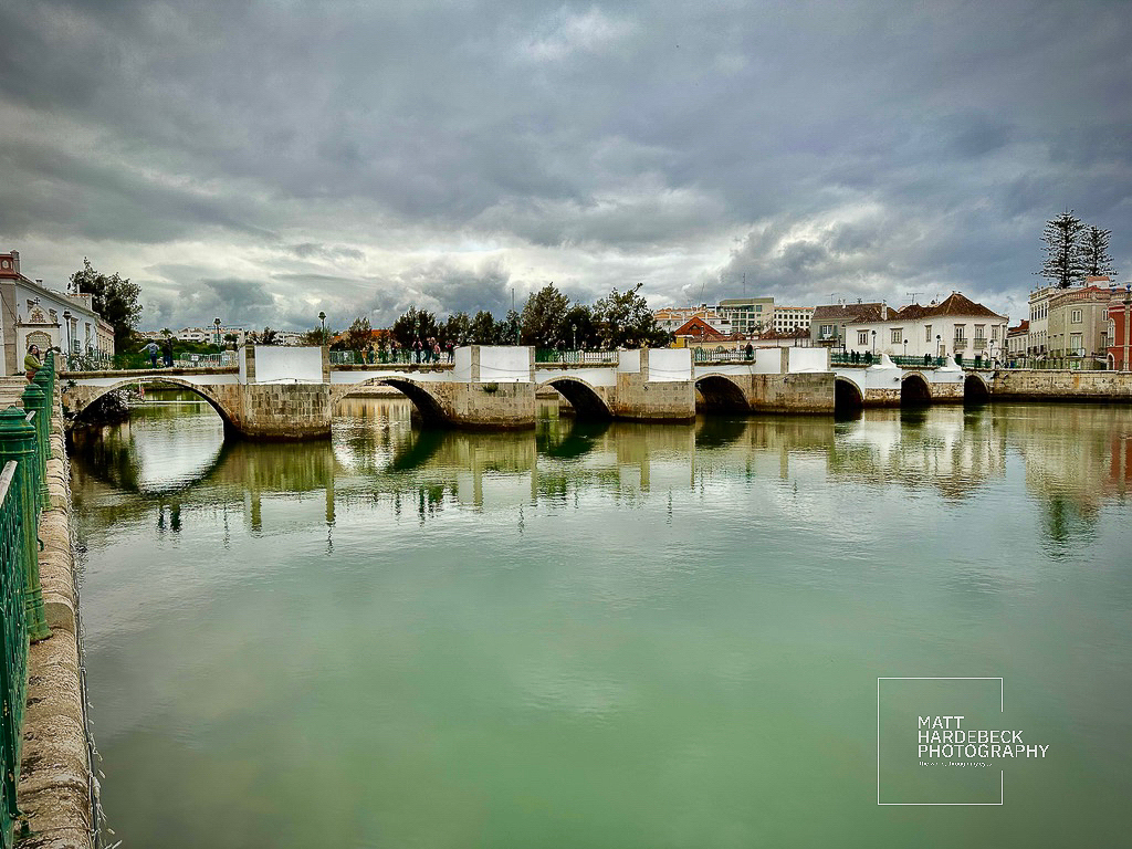 Whitewashed Roman bridge spanning the Gilão River in Tavira.