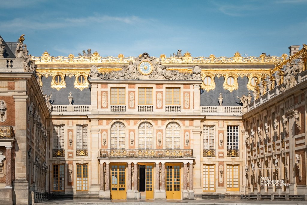 Symmetrical view of the main courtyard and façade of Versailles.